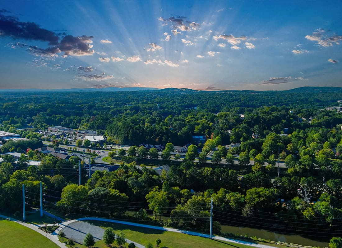 Canton, GA - Aerial View of Green Trees and Mountains Surrounding Canton Georgia on a Beautiful Day